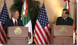 President George W. Bush and President Vicente Fox of Mexico participate in a press conference Jan. 12, 2004. "The bonds of friendship and shared values between our two nations are strong," said President Bush. "We have worked together to overcome many mutual challenges, and that work is yielding results." White House photo by Paul Morse.